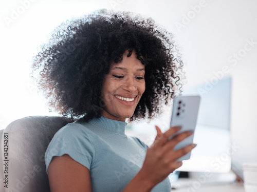 Smiling Woman Enjoying Using Phone While Sitting in Office photo