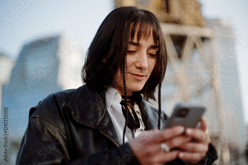 Outdoor woman using phone photo