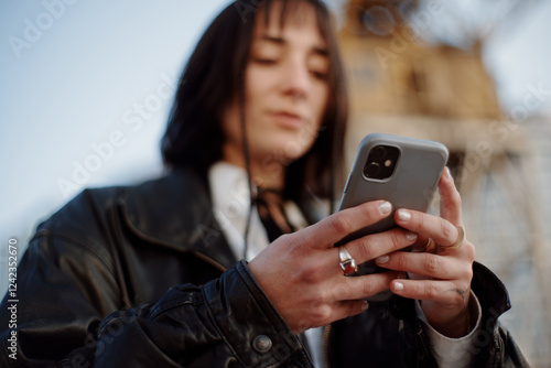 Outdoor woman using phone photo