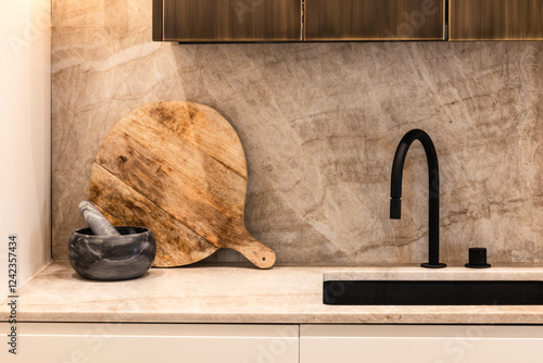 Minimalist kitchen with black faucet and rustic elements