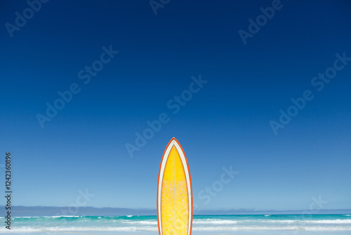 Retro yellow and orange surfboard. photo