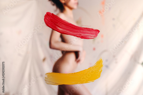 Artsy naked woman with paint strokes photo