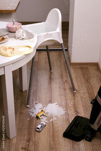 Washing vacuum cleaner against the mess on the floor. photo