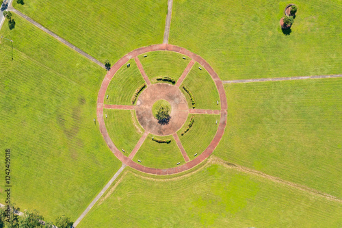 Aerial View of Circular Park Design with Central Tree and Benche photo