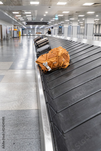 Luggage And Backpack On Airport Baggage Carousel photo