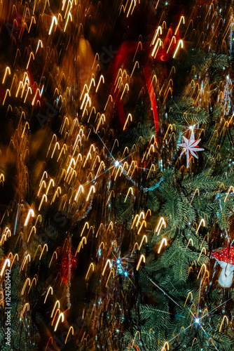 Bright holiday lights twinkling on a decorated Christmas tree photo