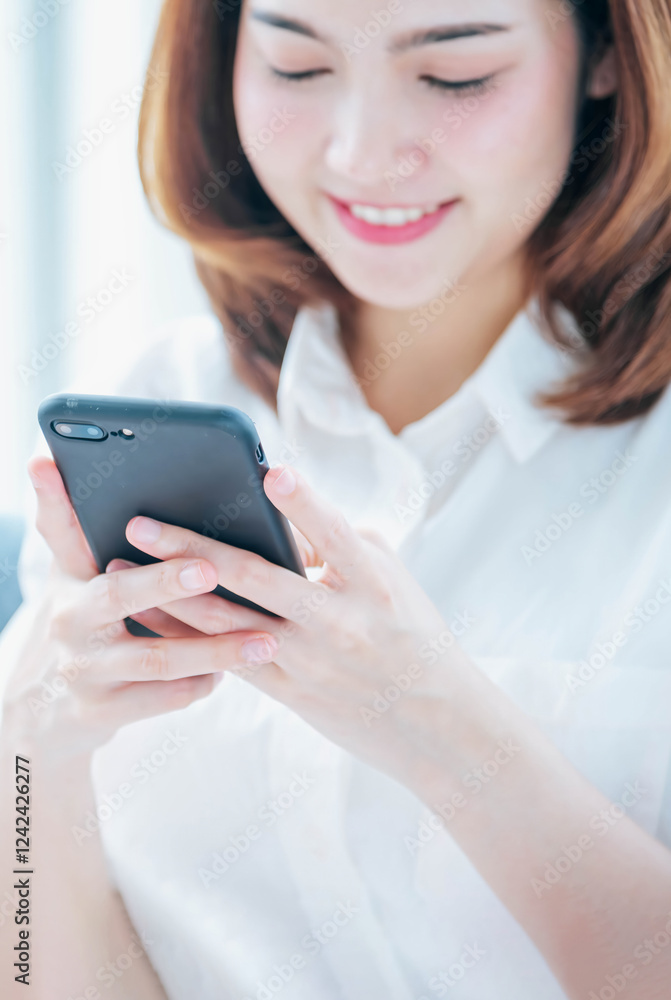 Vertical Horizon Smiling face asian woman holding smartphone with E-commerce Shopping online website Reading Online Article, Blog, vlog. Vertical Woman hands holding smart phone technology lifestyle Vertical Horizon Smiling face asian woman holding smartphone with E-commerce Shopping online website Reading Online Article, Blog, vlog. Vertical Woman hands holding smart phone technology lifestyle