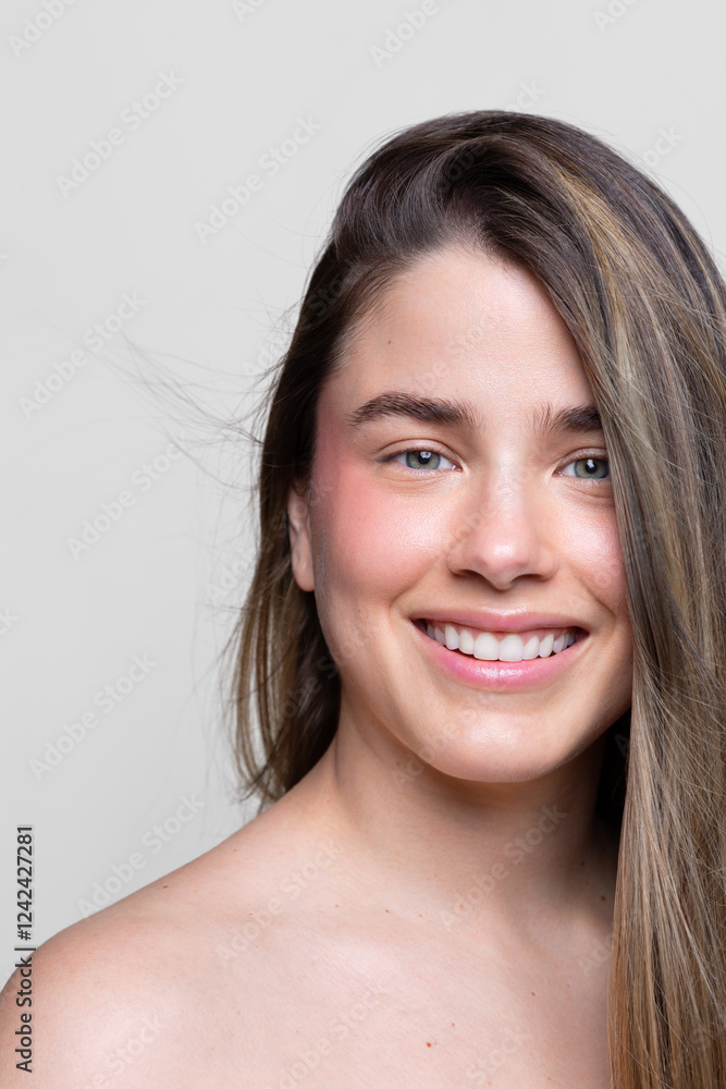 Smiling Young Woman with Radiant Skin and Flowing Hair Smiling Young Woman with Radiant Skin and Flowing Hair