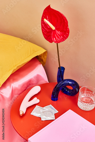 Modern bedside arrangement with vibrant accents and intimate ite photo