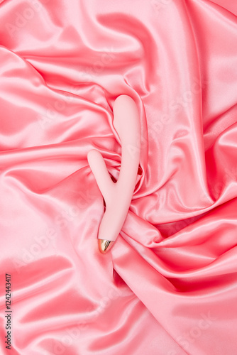 VIbration toy on Soft Pink Textile photo