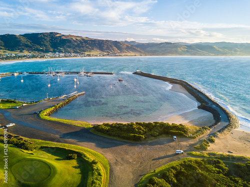 Breakwaters surrounding a coastal harbor photo