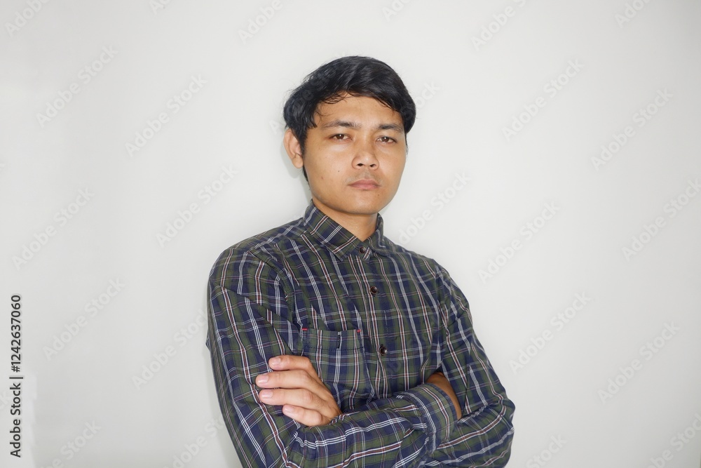 Indonesian men like to wear green shirts with confused, sullen, angry and happy expressions with various random hand movements on a plain white background Indonesian men like to wear green shirts with confused, sullen, angry and happy expressions with various random hand movements on a plain white background