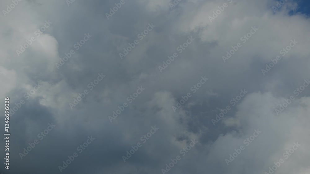 Big clouds moving fast in the sky, captured in a dynamic time-lapse shot Big clouds moving fast in the sky, captured in a dynamic time-lapse shot