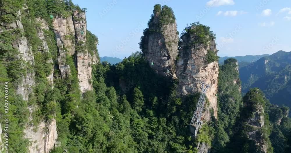 Aerial view ascending in front of gondolas to Huangshizhai in Zhangjiajie, China Aerial view ascending in front of gondolas to Huangshizhai in Zhangjiajie, China