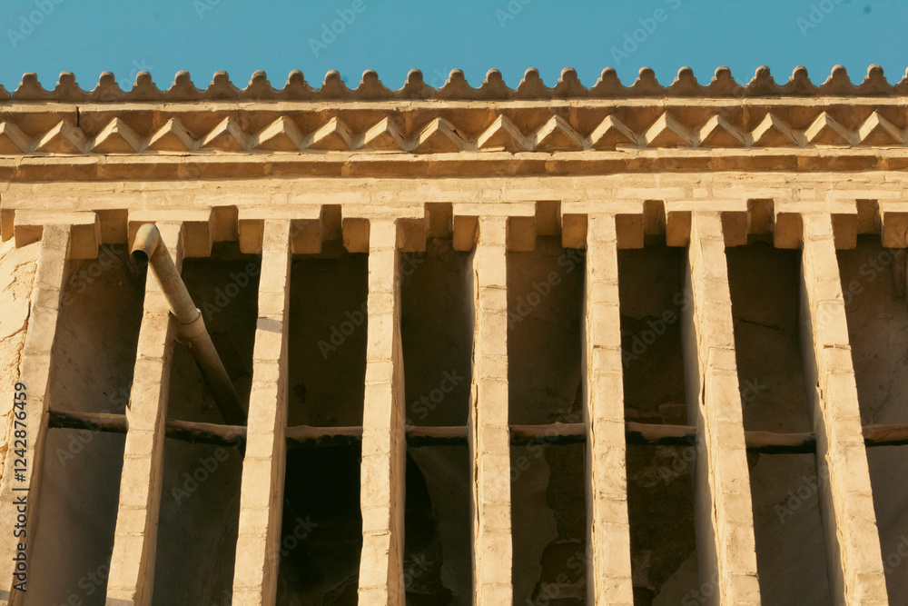 Details of the ornamental brick work designs on a wind-catching tower in Yazd, Iran. Details of the ornamental brick work designs on a wind-catching tower in Yazd, Iran.