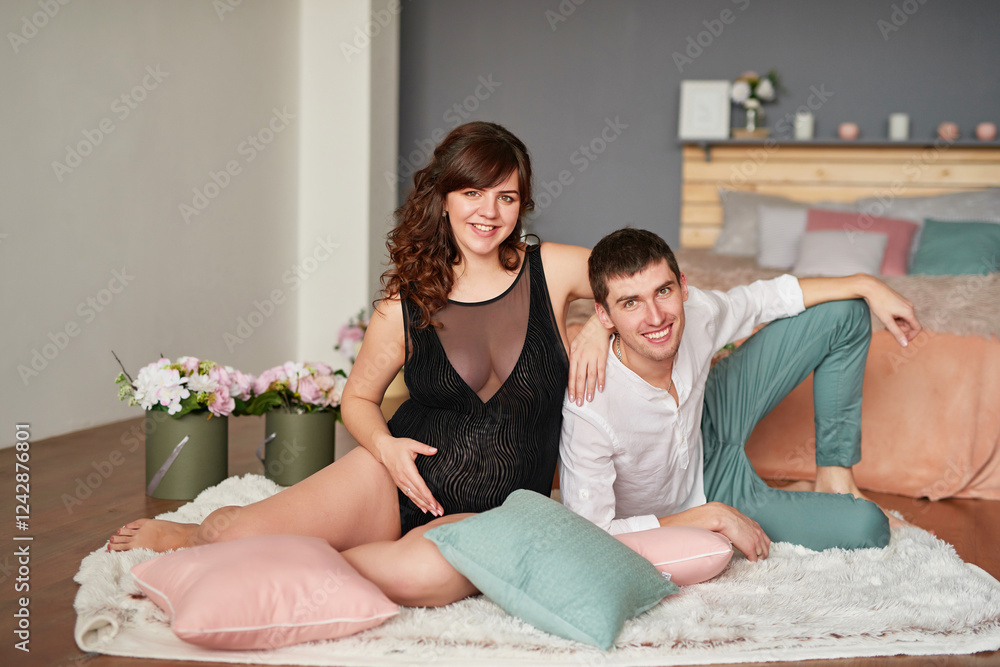 Obraz premium Mother's Day Greeting Card. Happy family, pregnant woman with flowers. Motherhood, pregnancy, happiness concept, married couple expecting a baby