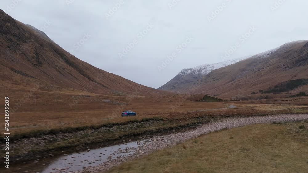 Cinematic tracking shot of a car driving through Glen Etive moors in Scotland Cinematic tracking shot of a car driving through Glen Etive moors in Scotland