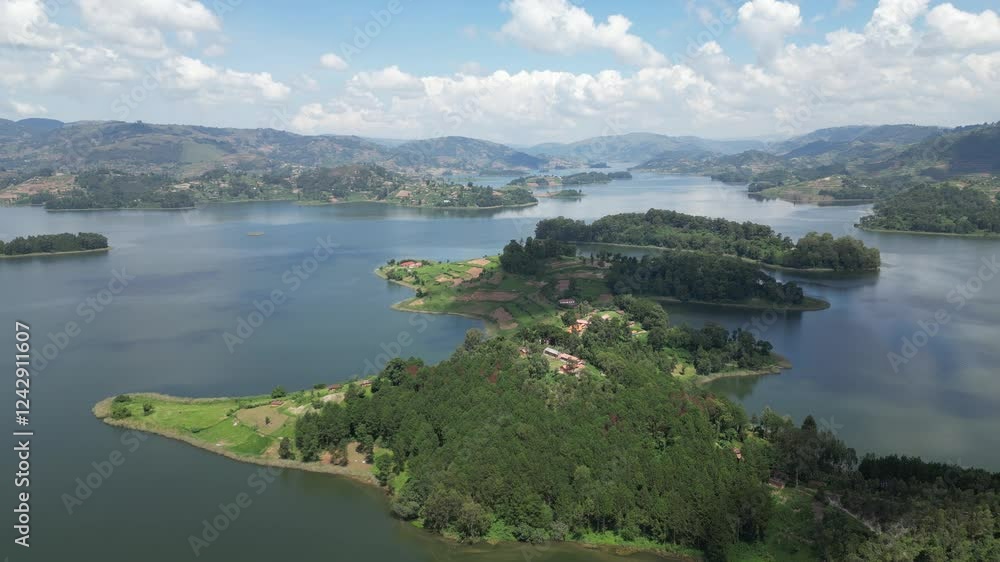 Uganda. Aerial view of Lake Bunyonyi, surrounded by lush green hills, small islands, and scattered settlements, creating a serene and picturesque landscape. Uganda. Africa. Uganda. Aerial view of Lake Bunyonyi, surrounded by lush green hills, small islands, and scattered settlements, creating a serene and picturesque landscape. Uganda. Africa.