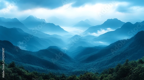 A captivating view of misty mountains enveloped in deep blue hues, showcasing a tranquil and serene atmosphere. Perfect for nature lovers and those seeking peaceful scenery. photo