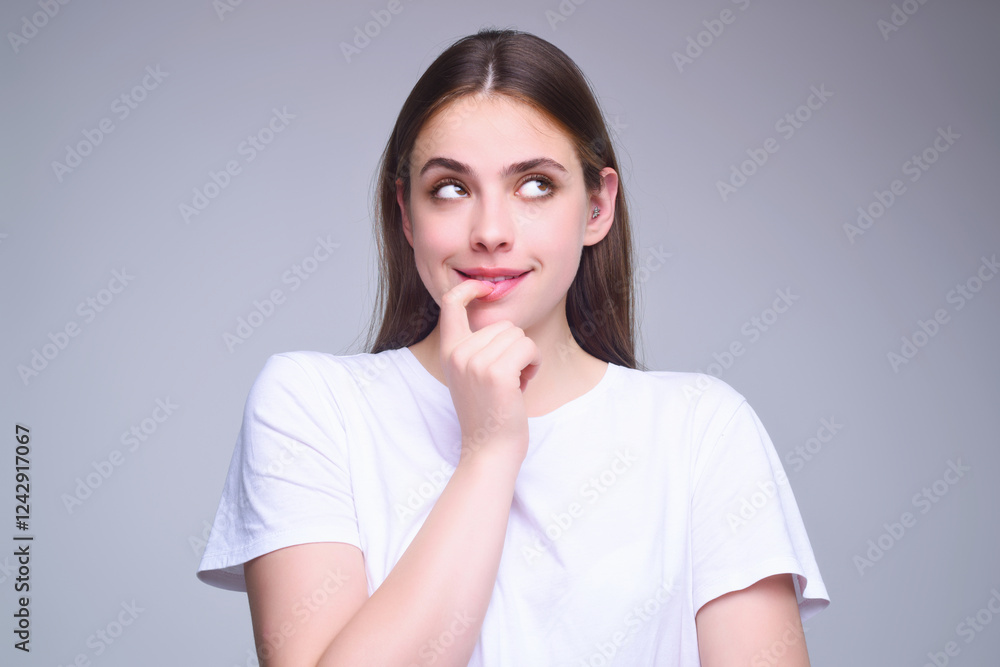 Surprised shocked young girl isolated over gray studio background. Close up shot of emotive shocked young woman opens mouth widely, Wow, unbelievable. People expressive emotions. Surprised shocked young girl isolated over gray studio background. Close up shot of emotive shocked young woman opens mouth widely, Wow, unbelievable. People expressive emotions.