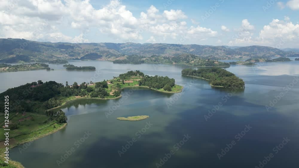 Uganda. Aerial view of Lake Bunyonyi, surrounded by lush green hills, small islands, and scattered settlements, creating a serene and picturesque landscape. Uganda. Africa. Uganda. Aerial view of Lake Bunyonyi, surrounded by lush green hills, small islands, and scattered settlements, creating a serene and picturesque landscape. Uganda. Africa.