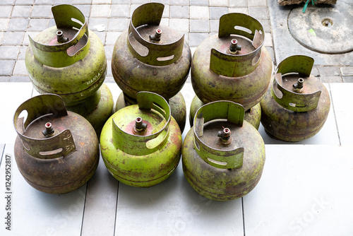 Stacks of 3kg LPG cylinders, briefly scarce due to policy changes ensuring distribution reaches low-income households. Essential cooking fuel, now readily available. Shows efforts to target subsidies  photo