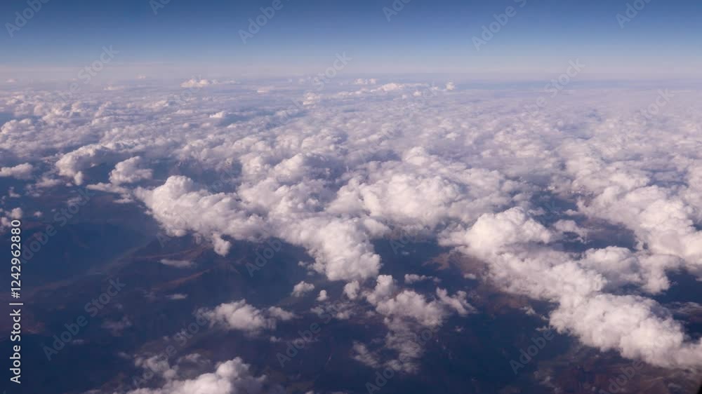 Aerial View of Fluffy Clouds and Landscape Aerial View of Fluffy Clouds and Landscape