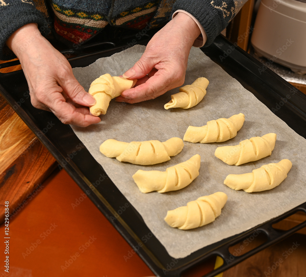 Croissant preparation in a cozy kitchen during afternoon baking session with family