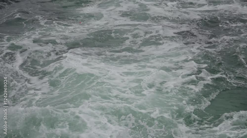 4k aerial video capturing waves crashing on rocky shoreline with dramatic coastline views during overcast weather 4k aerial video capturing waves crashing on rocky shoreline with dramatic coastline views during overcast weather