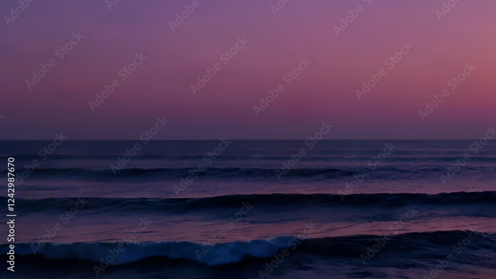 Fototapeta premium Deep blue waves rolling across vast ocean surface, twilight painting sky with purple, pink, orange gradient. Sea sunset concept