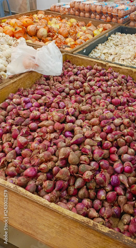 Piles of red onion baskets in the market. Semarang-Central Java. 01-06-2025
