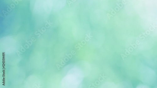 ゆっくりと風に揺れる自然の草原のボケたイメージ。柔らかな日差し。環境コンセプト。清涼感ある薄い青緑色。パンニングショット。
Natural meadow grass slowly swayed by wind blow. Soft sunlight. Environment concept. Bokeh. Light verdigris. Panning shot.