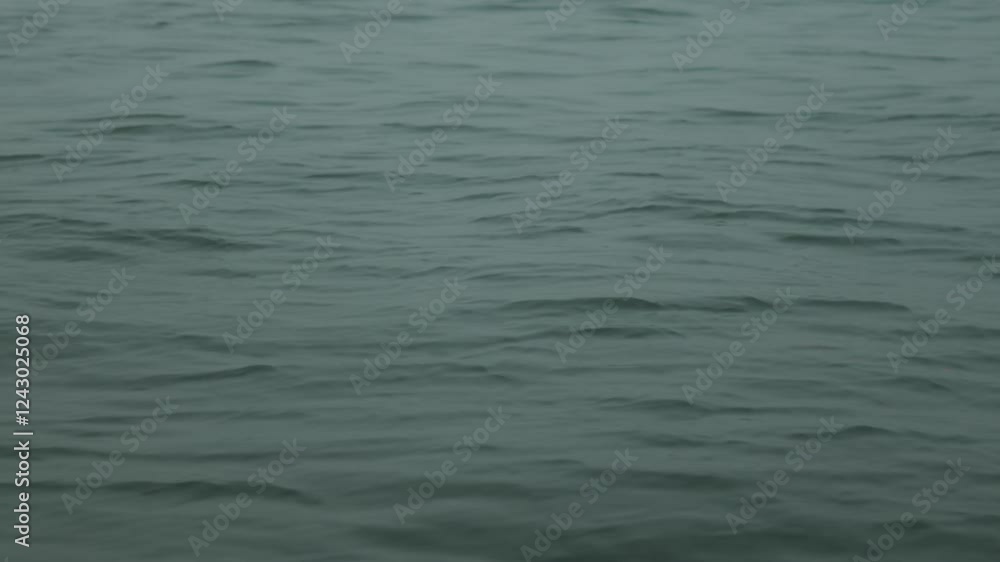 Waves gently .moving on the surface of the ocean near India, creating a calm atmosphere Waves gently .moving on the surface of the ocean near India, creating a calm atmosphere