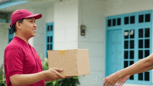 Wallpaper Mural Male Courier Hands Over Cardboard Box to Customer Close-Up. Delivery Driver Passing Parcel in Slow Motion. Shipping delivery, cardboard box, courier, parcel delivery, customer handoff Torontodigital.ca