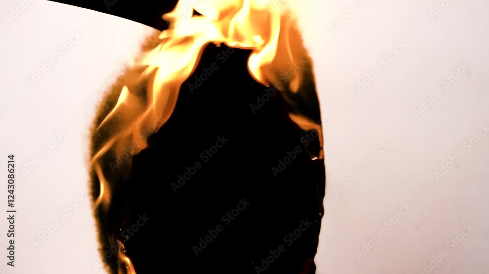 Film burn video transitions. Monochrome texture. Animated paper burning on fire background. High quality 4k footage