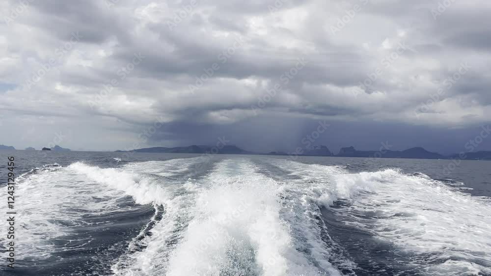 custom made wallpaper toronto digitalLuxury Yacht Racing at Full Speed under British Flag, Heading Towards Storm, Dramatic Cloudy Sky, Black Thundercloud on Horizon, Wake Trail Behind, Rear View of the Boat. Stock video footage