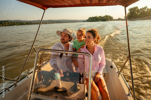 Happy family enjoying a relaxing speedboat ride on a picturesque lake at sunset, creating lasting summer memories together while soaking in the joy of nature and each other's company