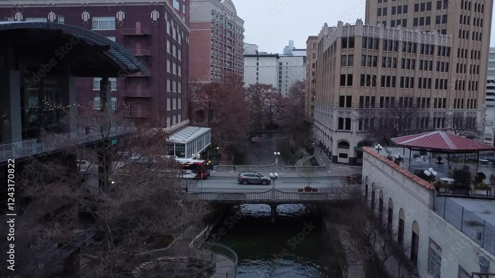 A drone glides in slow motion over a city river, capturing rippling water, glowing lights, and bridges in detail. A drone glides in slow motion over a city river, capturing rippling water, glowing lights, and bridges in detail.