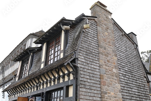 Mont-Saint-Michel: Wood-shingle clad mansard roof and wall, built-in stone-masonry chimney, half-timber building east-north angle. Normandy-France-171 photo