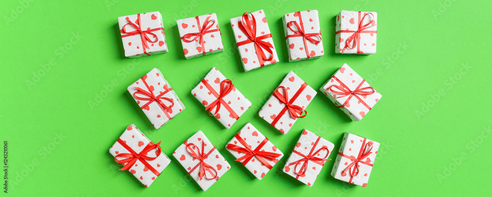 Top view of white gift boxes with hearts on colorful background. Valentine's Day concept Top view of white gift boxes with hearts on colorful background. Valentine's Day concept
