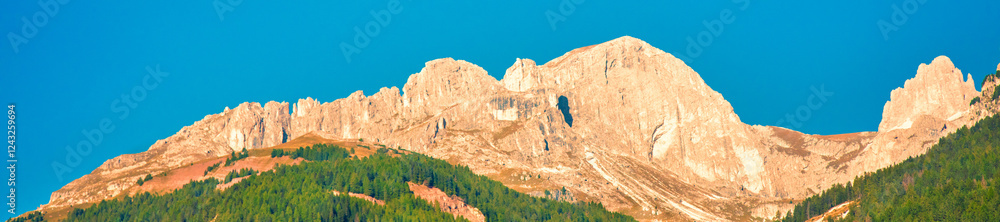 Mountain landscape with clear blue sky on a sunny day. Mountains of the Dolomites. Thought Tyrol, Italy Europe. Horizontal banner