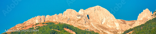 Obraz na płótnie Mountain landscape with clear blue sky on a sunny day. Mountains of the Dolomites. Thought Tyrol, Italy Europe. Horizontal banner w salonie