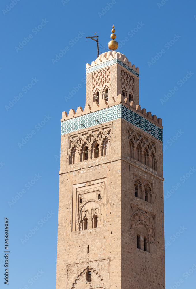 Fototapeta premium The Koutoubia Mosque Minaret in Marrakech, Morocco, is the largest and most iconic mosque in the city, known for its stunning architecture.
