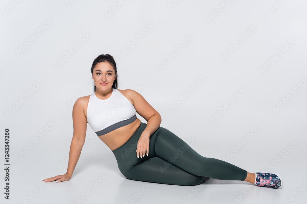 Fit female athlete showcasing strength and beauty in stylish fitness attire Fit female athlete showcasing strength and beauty in stylish fitness attire