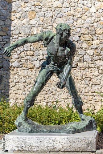 Castle Otocec - Slovenia. Monument to the Youth Labor Brigades photo