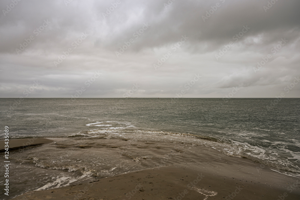 Cloudy Seascape with Sandy Beach and Gentle Waves, De Cocksdorp, Texel, Netherlands Cloudy Seascape with Sandy Beach and Gentle Waves, De Cocksdorp, Texel, Netherlands