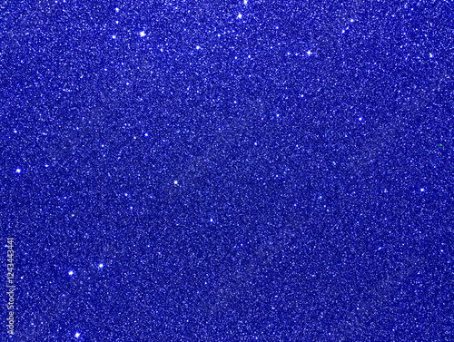 Royal blue sparkle background. Blue glitter background. Blue glimmer. Abstract twinkle texture. Glitter surface. Glimmer layout. Holiday layout. Diamond, stars surface. Celebration holiday background.