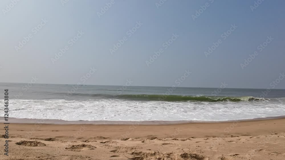 Yellow Sandy Beach With Rolling Waves And Sea Shore With Blue Sky Yellow Sandy Beach With Rolling Waves And Sea Shore With Blue Sky