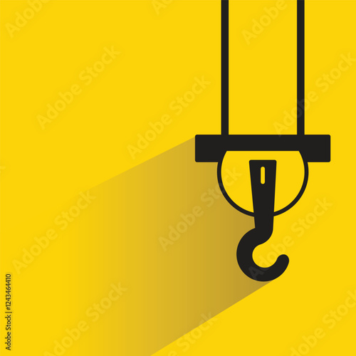 pulley and crane hook icon with shadow on yellow background