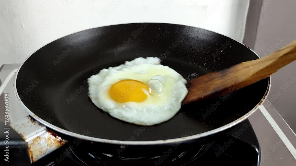 The process of cooking fried eggs directly in the frying pan The process of cooking fried eggs directly in the frying pan